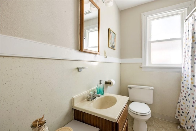 full bath featuring toilet, vanity, tile patterned flooring, and a shower with curtain