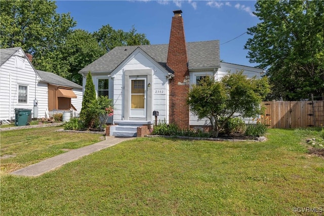 view of front of property with a chimney and roof with shingles