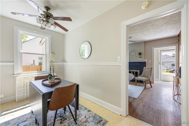 dining room featuring baseboards and a ceiling fan