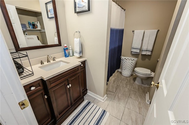 full bath featuring vanity, toilet, tile patterned flooring, and baseboards