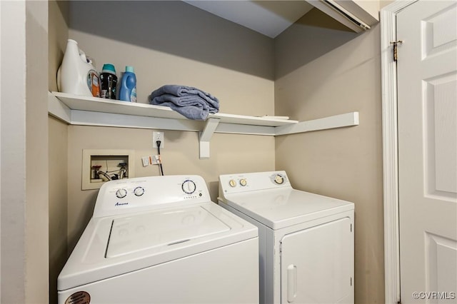 clothes washing area featuring washing machine and dryer