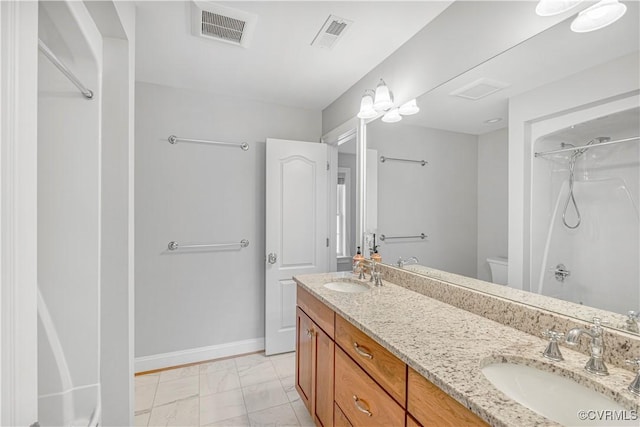 full bath with a sink, marble finish floor, and visible vents