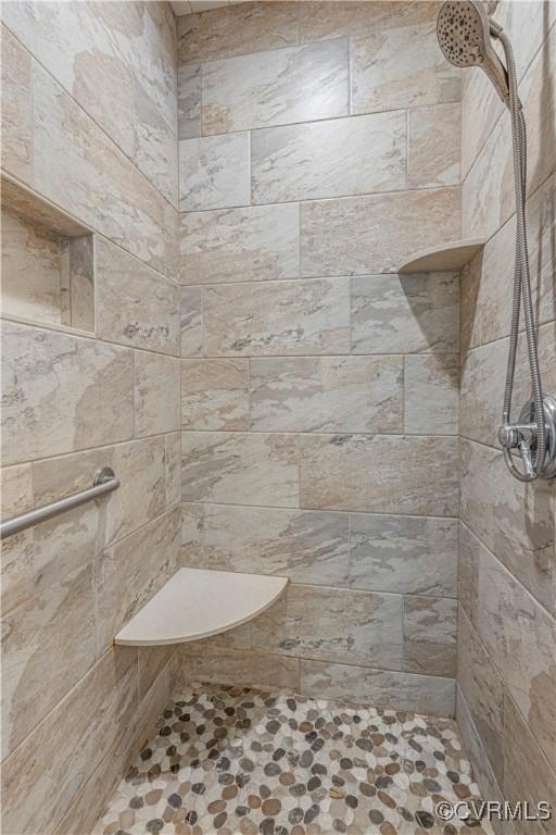 full bathroom with tiled shower