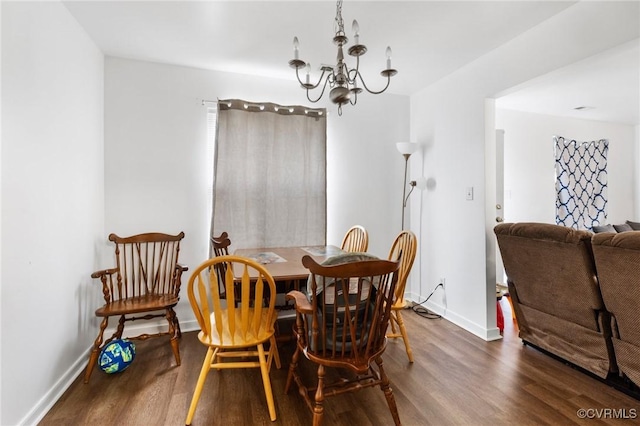 2507 Wright Ave, Richmond, VA 23224 - dining room with dark wood-style floors, a chandelier, and baseboards