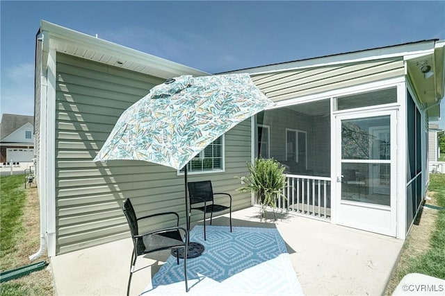 view of patio featuring a sunroom