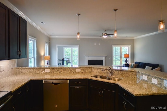kitchen with a sink, stainless steel dishwasher, a ceiling fan, and open floor plan