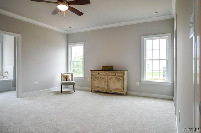 sitting room featuring carpet floors, ceiling fan, plenty of natural light, and crown molding
