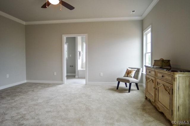 living area with visible vents, ornamental molding, ceiling fan, and light carpet