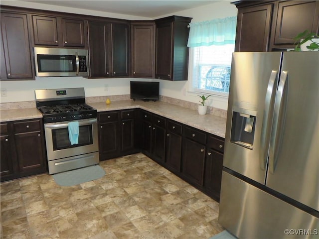 1632 Chestnut Park Ln, Richmond, VA 23222 - kitchen with light countertops, appliances with stainless steel finishes, and stone finish floor