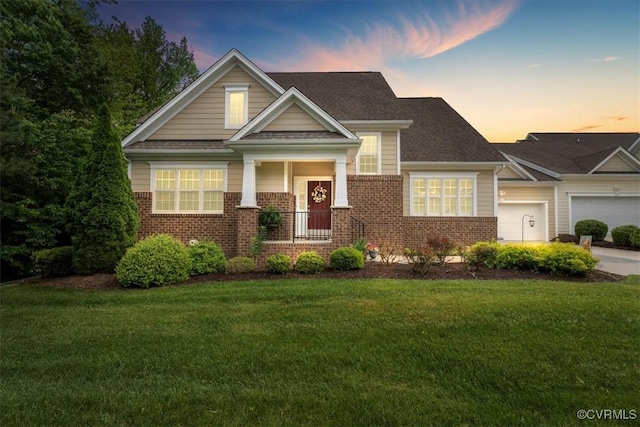 7315 Cornus Ave, Chesterfield, VA 23832 - view of front facade featuring covered porch, roof with shingles, brick siding, and a front lawn
