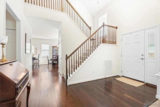 7315 Cornus Ave, Chesterfield, VA 23832 - foyer entrance featuring baseboards, visible vents, stairs, a towering ceiling, and wood finished floors