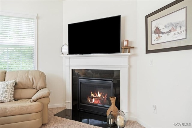7315 Cornus Ave, Chesterfield, VA 23832 - living area featuring carpet flooring, baseboards, and a fireplace with flush hearth