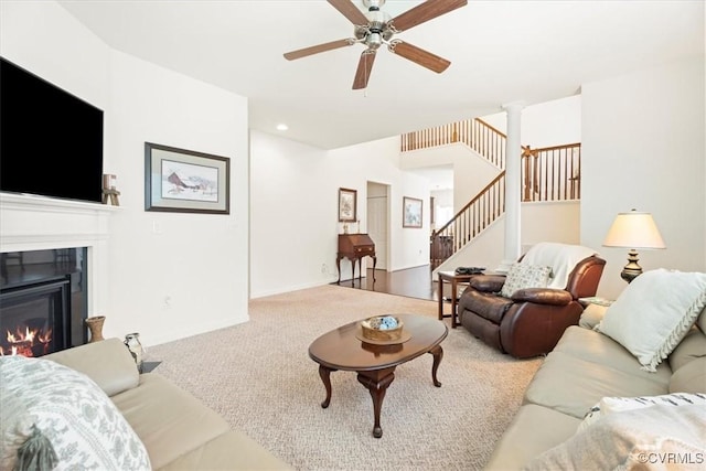 7315 Cornus Ave, Chesterfield, VA 23832 - carpeted living room with stairway, ceiling fan, baseboards, and a glass covered fireplace