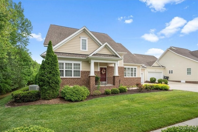 7315 Cornus Ave, Chesterfield, VA 23832 - craftsman house featuring roof with shingles, brick siding, concrete driveway, a garage, and a front lawn