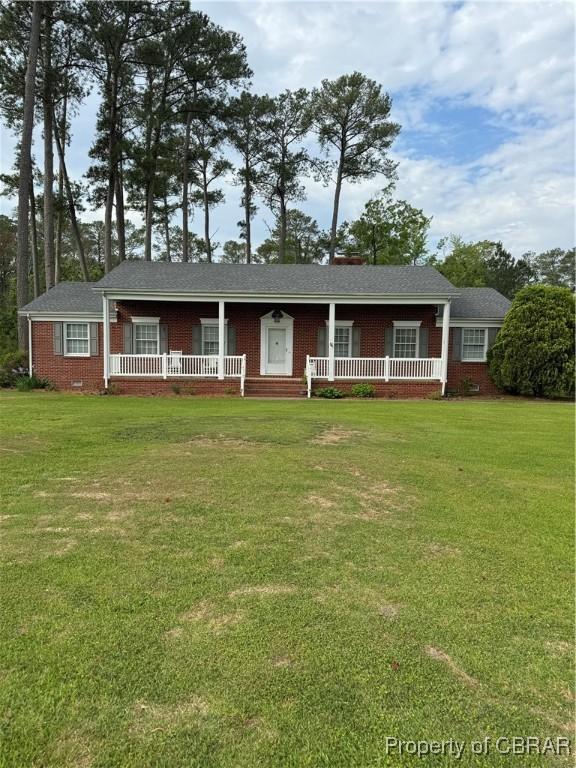 79 Blue Crab Dr, Moon, VA 23109 - ranch-style home featuring a porch, brick siding, and a front yard
