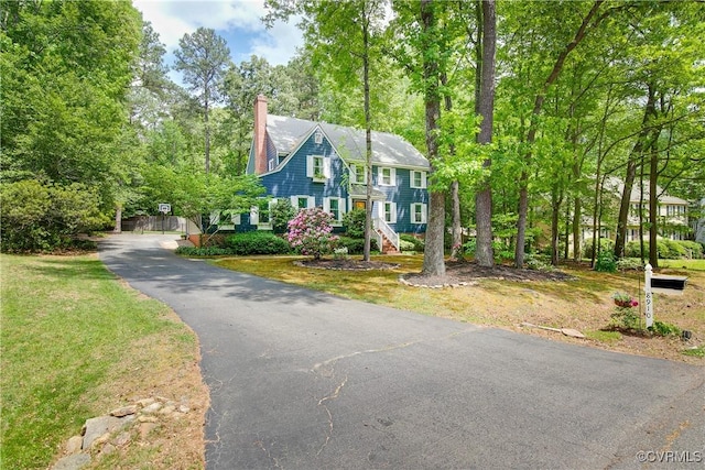 colonial home featuring a chimney