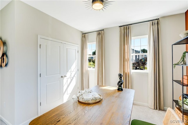 office space with light colored carpet and baseboards
