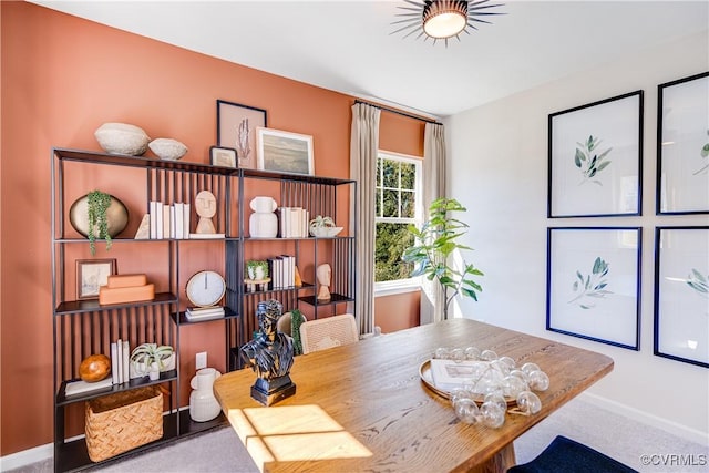 carpeted home office featuring baseboards