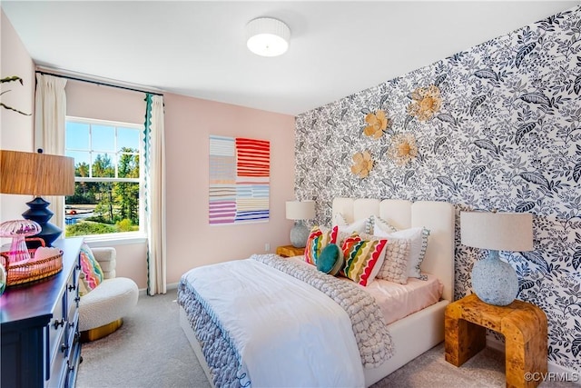 bedroom featuring carpet flooring and baseboards