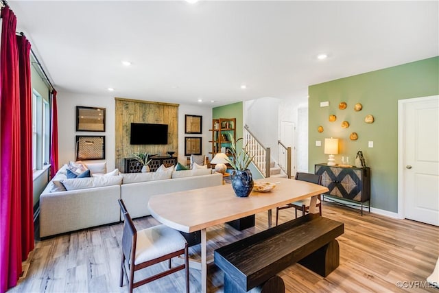 dining room featuring stairway, baseboards, light wood-type flooring, and recessed lighting
