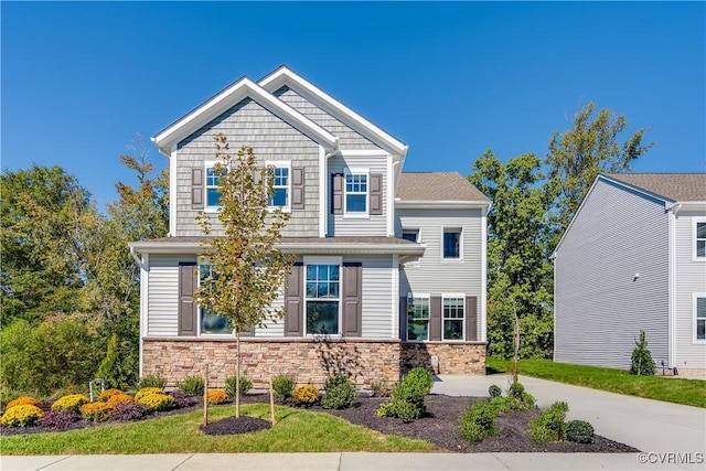 craftsman-style home with stone siding