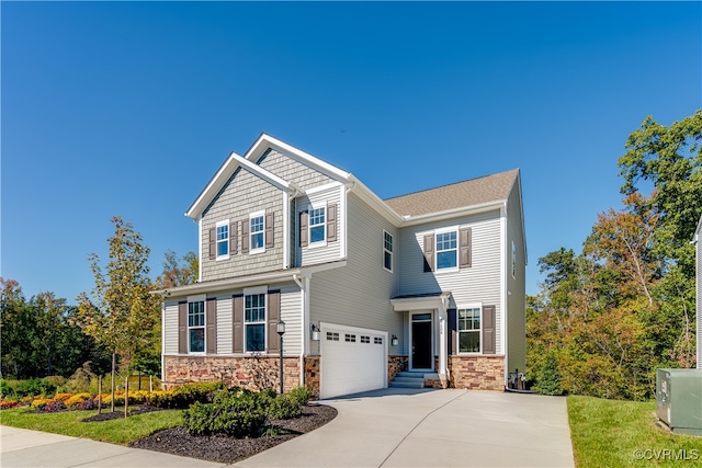 craftsman-style house with concrete driveway, an attached garage, and stone siding