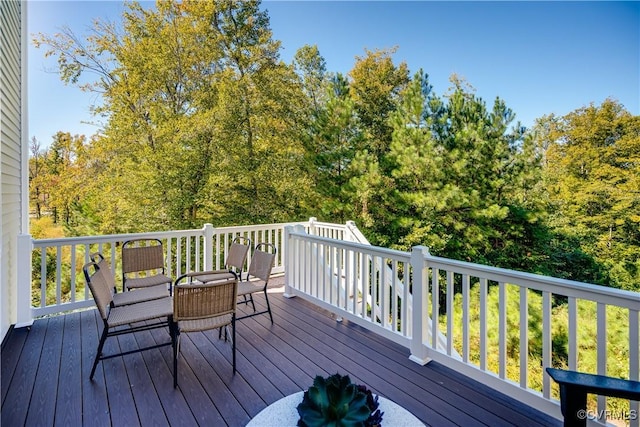 wooden deck with outdoor dining space