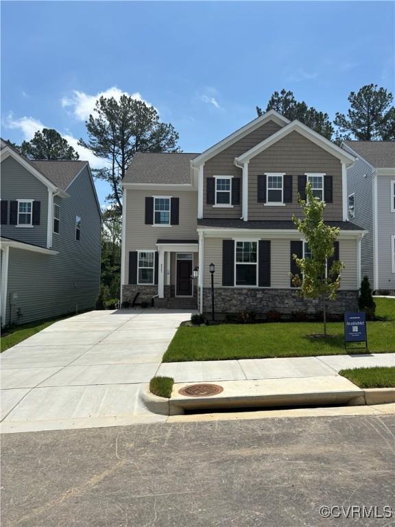 6645 Cassia Loop, Moseley, VA 23120 - craftsman-style house with stone siding, concrete driveway, and a front yard