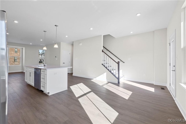1255 Lazy River Rd, Chesterfield, VA 23114 - kitchen featuring a kitchen island with sink, dark wood-type flooring, dishwasher, white cabinets, and baseboards