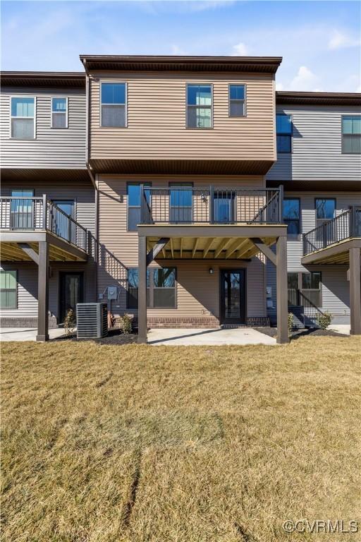 1255 Lazy River Rd, Chesterfield, VA 23114 - rear view of house with a lawn and cooling unit