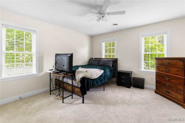 bedroom featuring carpet flooring, baseboards, and a ceiling fan