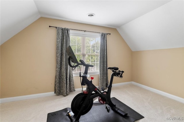 workout area with vaulted ceiling, carpet floors, and baseboards