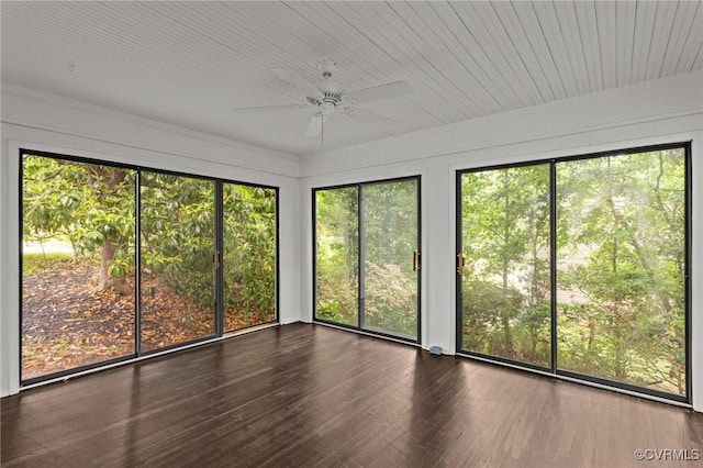 unfurnished sunroom with wood finished floors and ornamental molding