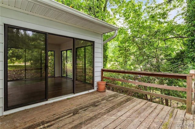 wooden deck featuring a sunroom