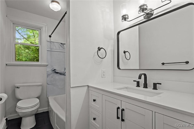 full bathroom featuring toilet, vanity, tile patterned flooring, and bathtub / shower combination