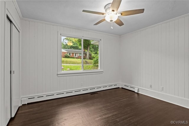 unfurnished bedroom with dark wood finished floors, a closet, ceiling fan, and crown molding
