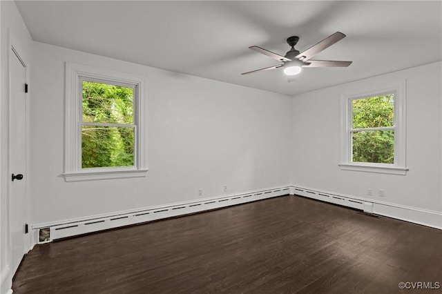 spare room with healthy amount of natural light, dark wood-style floors, and a ceiling fan