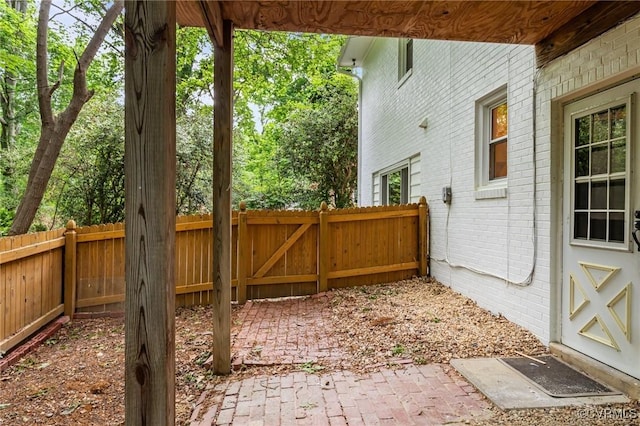 view of patio featuring fence
