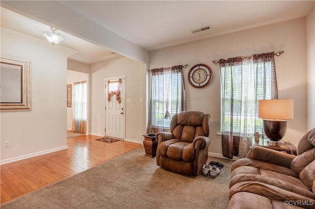 living room featuring wood finished floors and baseboards