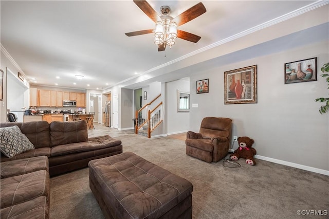 living room featuring stairway, ornamental molding, recessed lighting, ceiling fan, and light carpet