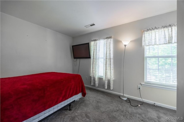 carpeted bedroom with baseboards