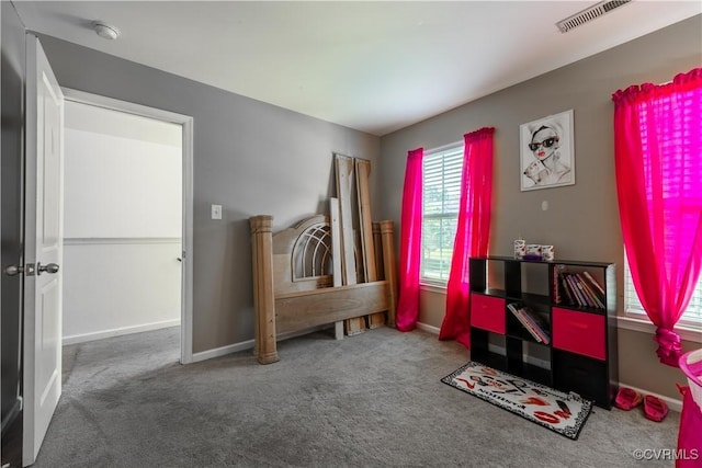 bedroom with carpet floors and baseboards