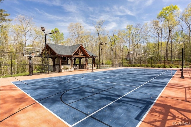 view of basketball court with a gazebo, fence, and community basketball court