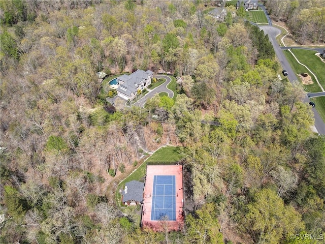 drone / aerial view featuring a forest view