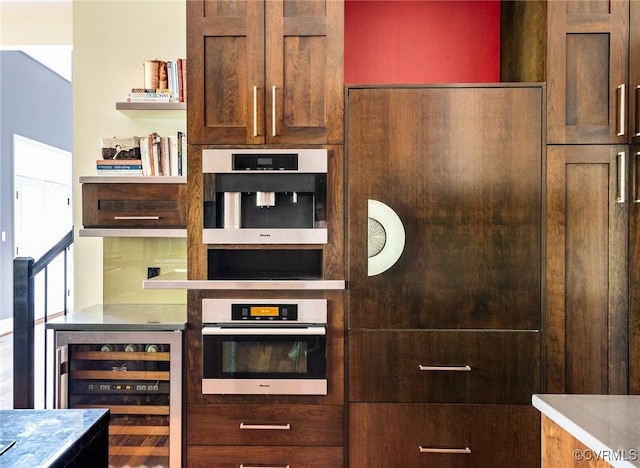 interior space featuring open shelves, beverage cooler, and stainless steel oven