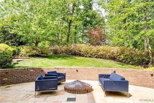 view of patio / terrace featuring an outdoor fire pit