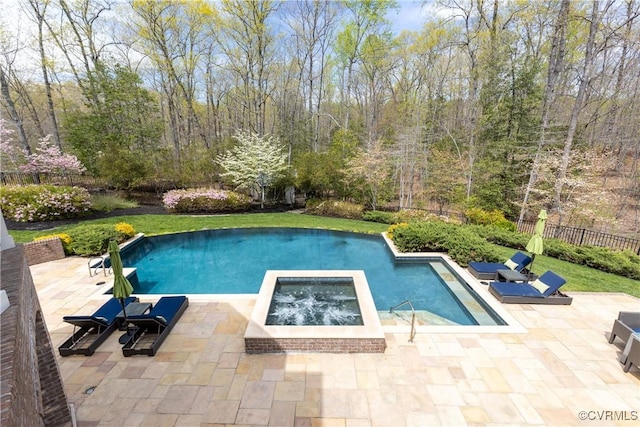 outdoor pool featuring an in ground hot tub, fence, and a patio area