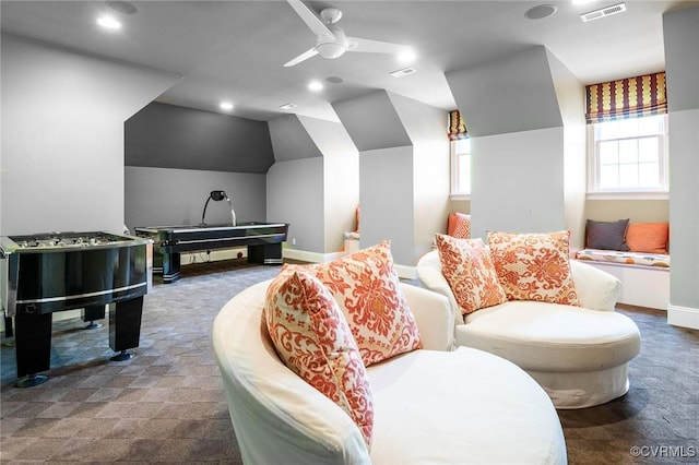 carpeted cinema featuring lofted ceiling, visible vents, recessed lighting, a ceiling fan, and baseboards