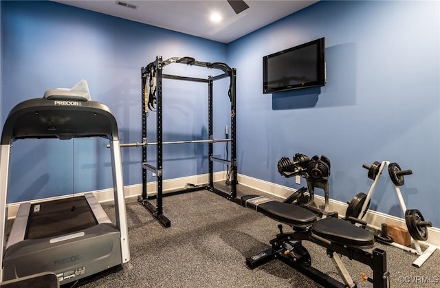 workout area featuring baseboards