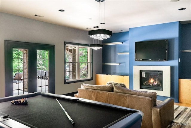 playroom with billiards, a wealth of natural light, visible vents, and a notable chandelier